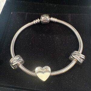 Never worn Pandora Charm Bracelet with discontinued wedding charm
